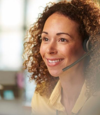 Person Speaking On The Phone With A Headset, The Prime College