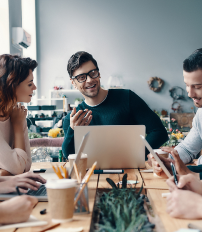 Team Leader At Table In Front Of The Team Talking, The Prime College