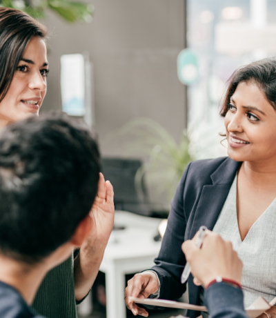 Image Of Operations Manager Talking With Colleagues, The Prime College
