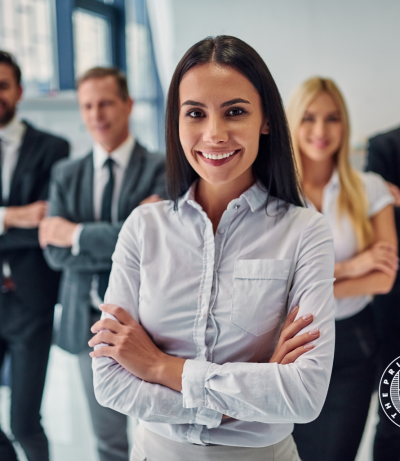 Professional In Foreground With Its Team In The Background, Happy Professional, The Prime College