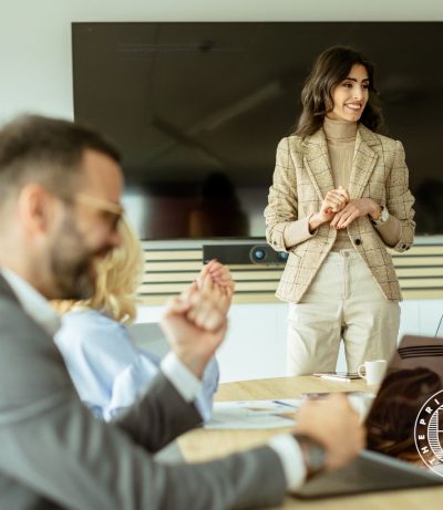 lady in front of the room giving speech, The Prime College